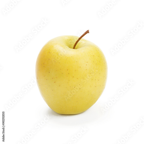 Golden Delicious apple on a white background