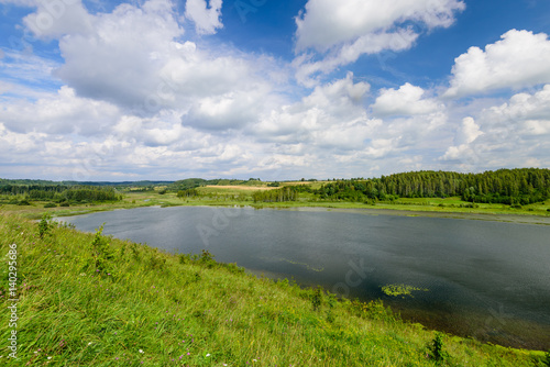 Fototapeta Naklejka Na Ścianę i Meble -  Traditional Russian nature in summer. Picturesque lake Gorodischenskoe, Old Izborsk, Pskov, Russia.
