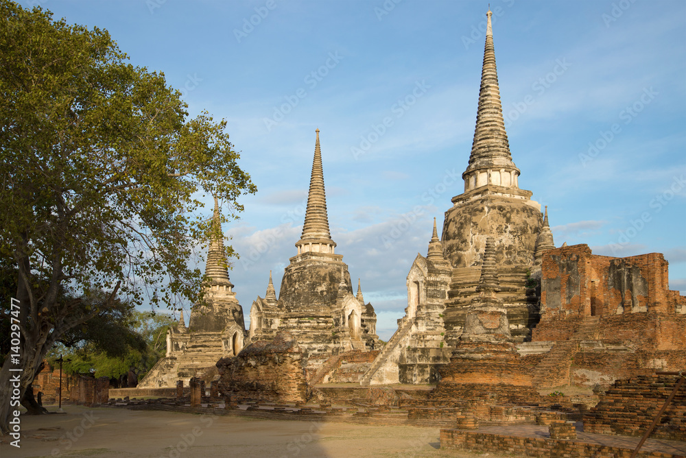 The ancient stupas of the buddhist temple of Wat Phra Si Sanphet on a sunny morning. Ayutthaya, Thailand