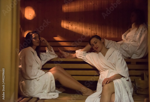 a group of young women in a sauna