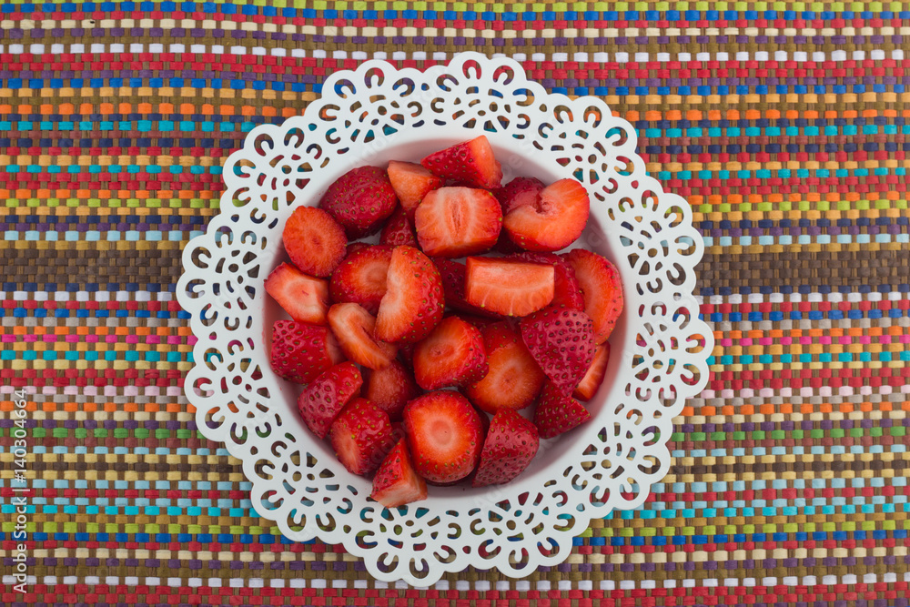 Strawberries on a white plate / Red Freshly cut strawberries on a white artistic plate Strawberries on a white plate / Red Freshly cut strawberries on a white artistic plate
