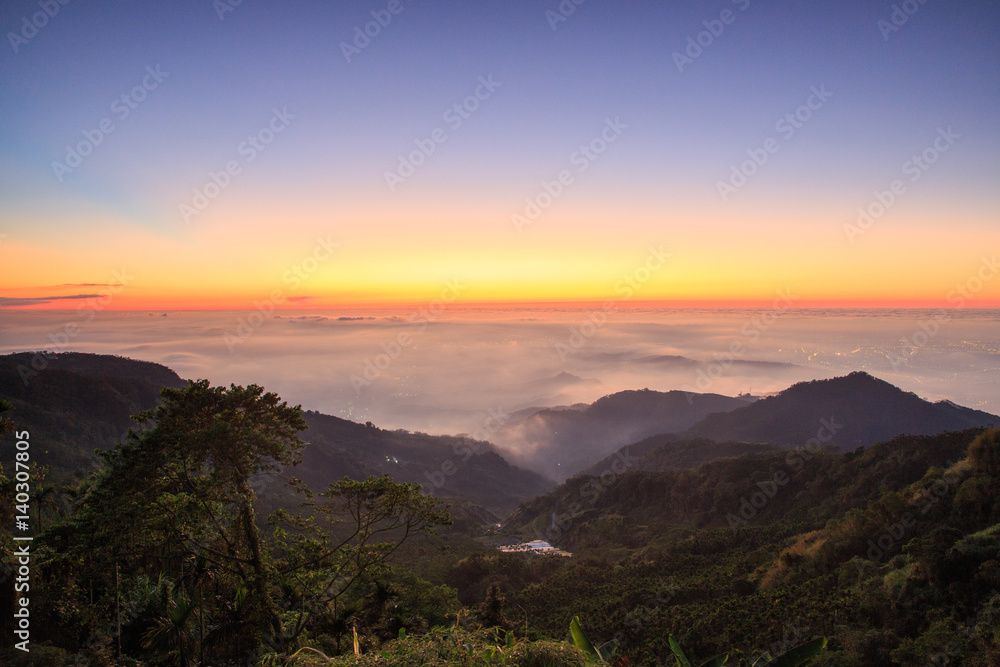 Obraz premium The sunset on the mountain,The whole sky was dyed orange,Taiwan,Asia.