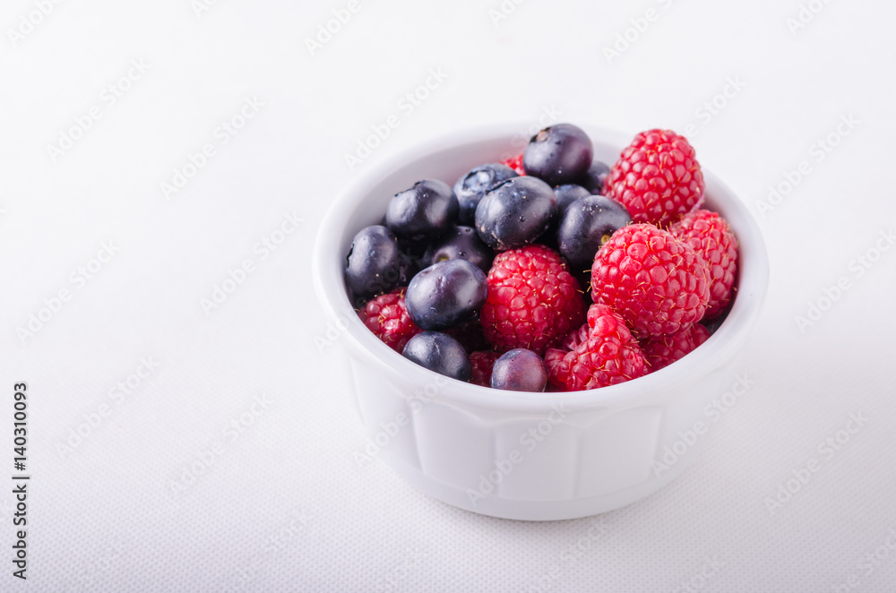Berries in white bowl Berries in white bowl
