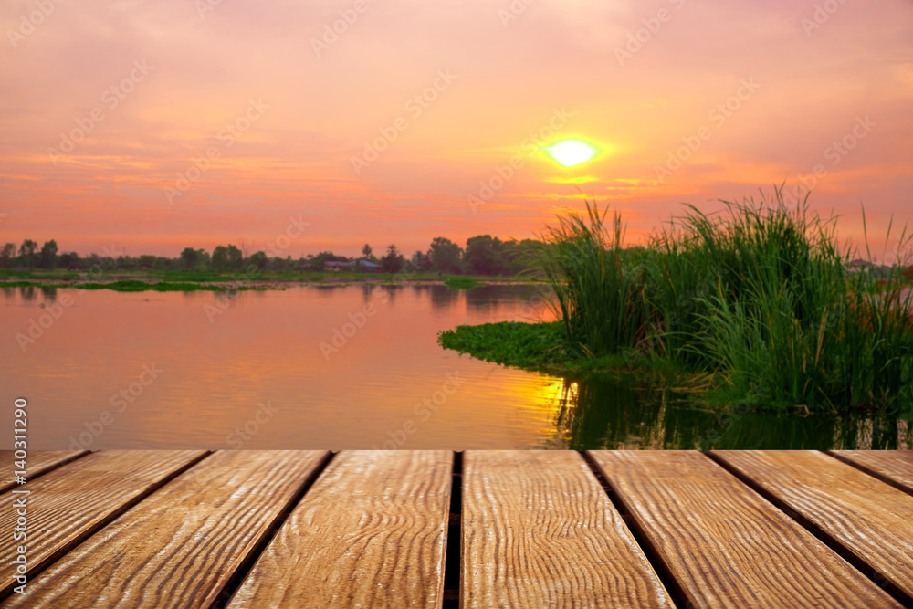 Empty Old Wooden table with River during sunset background .