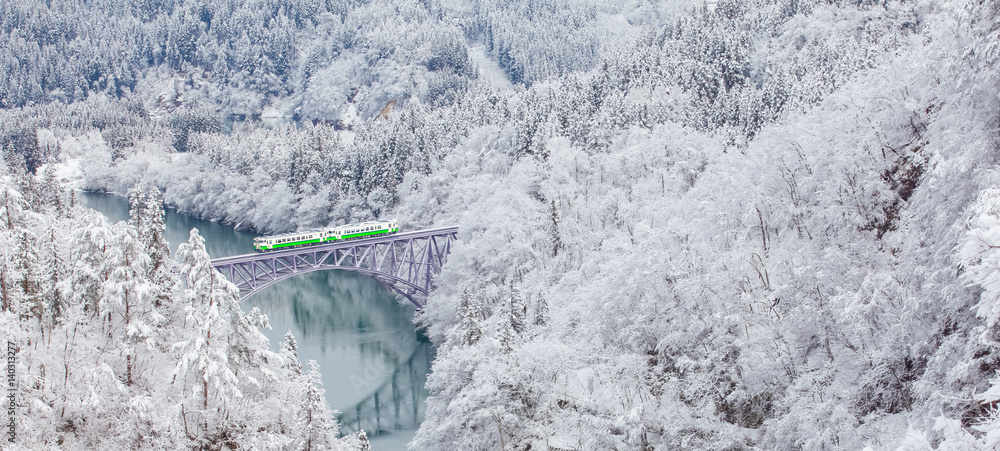 Obraz premium Japan mountain and snow with local train in winter season at Mishima town , Fukushima prefecture