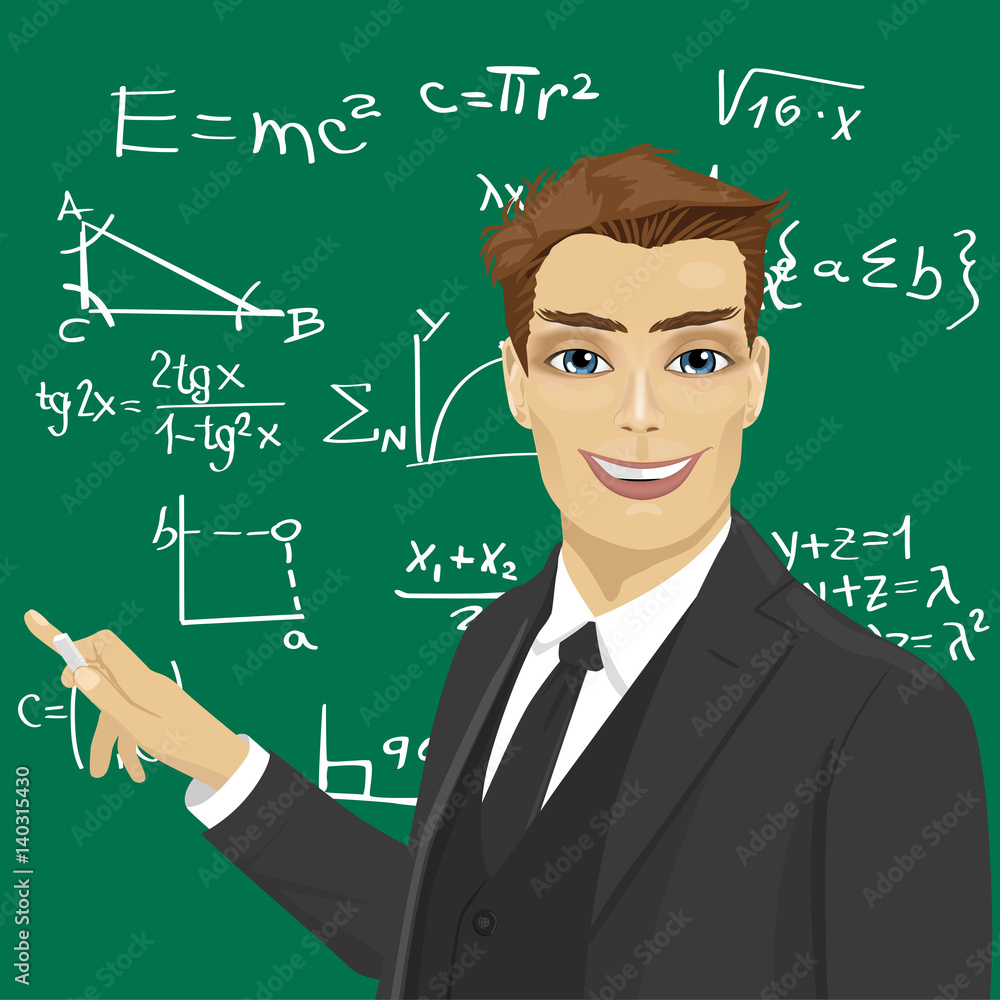 young male math teacher with piece of chalk standing next to blackboard