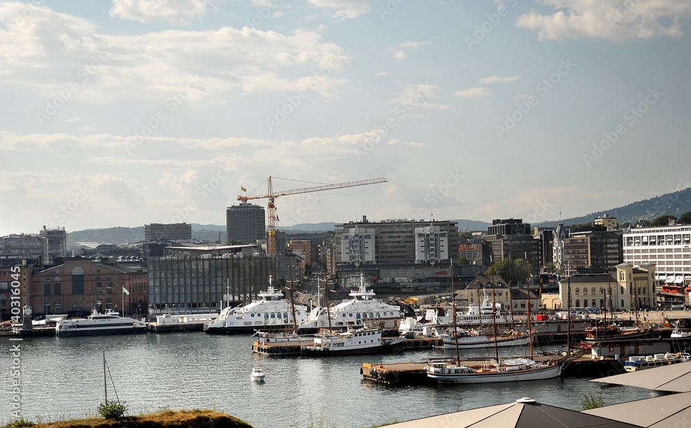 View of the Oslo's harbour promenade, Norway. The Oslo Norway harbor is one of Oslo's great attractions. Situated on the Oslo Fjord, the harbor front is a popular destination for tourists.