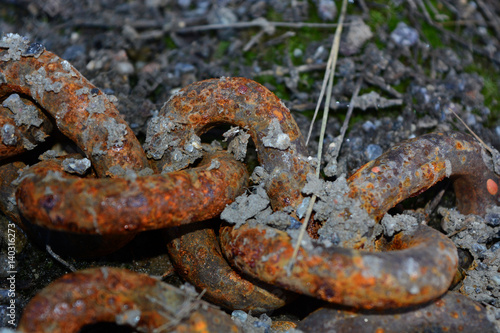 Rusty chain on the ground © Victoria Meyo