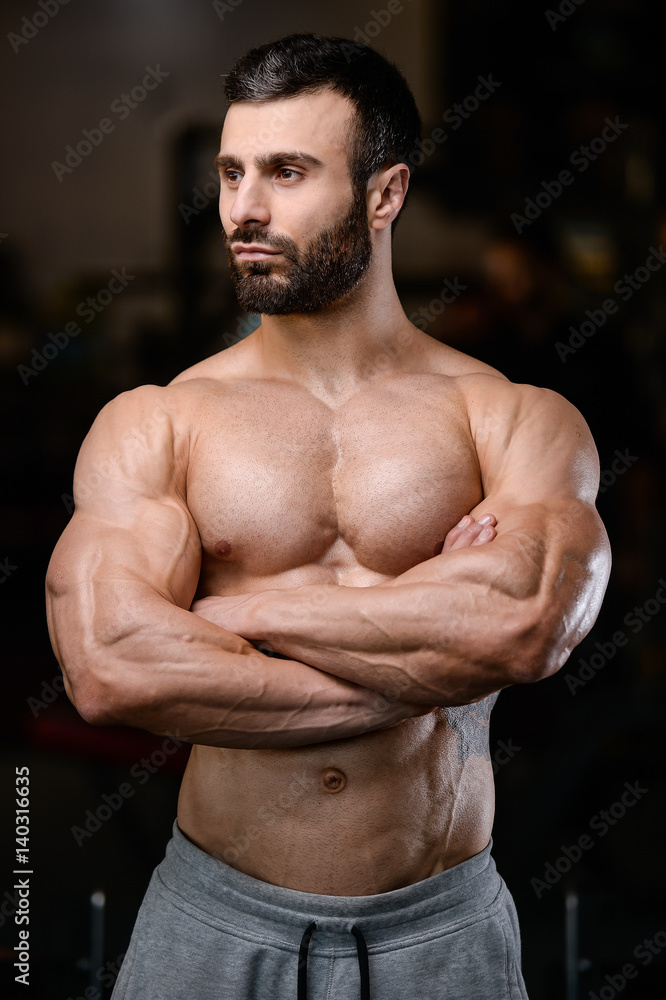 Fototapeta premium Brutal caucasian handsome fitness men on diet training chest pumping
