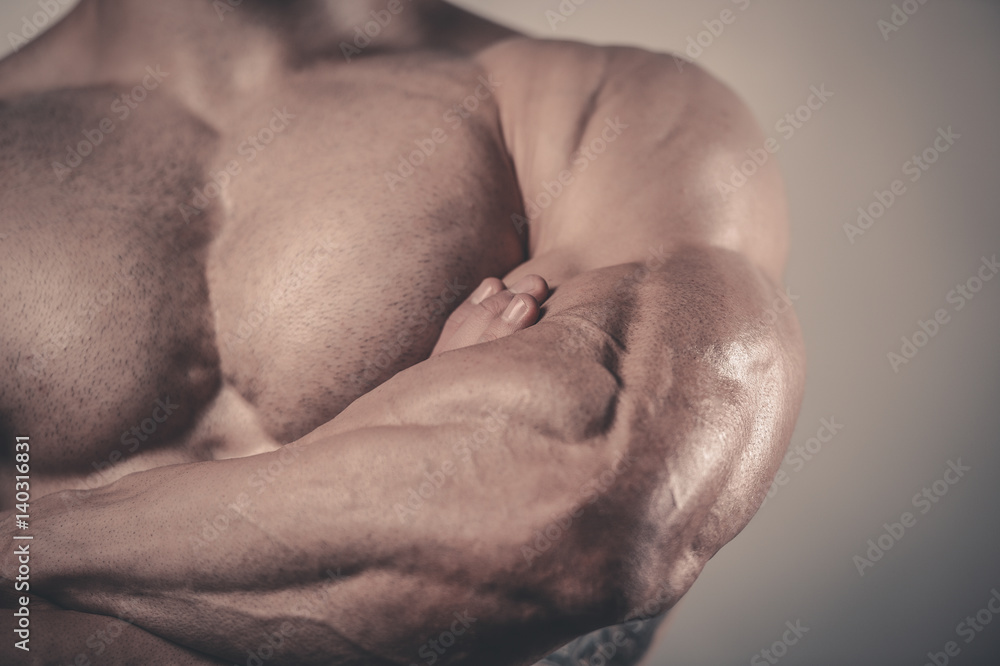 Naklejka premium Brutal caucasian handsome fitness men on diet training chest pumping