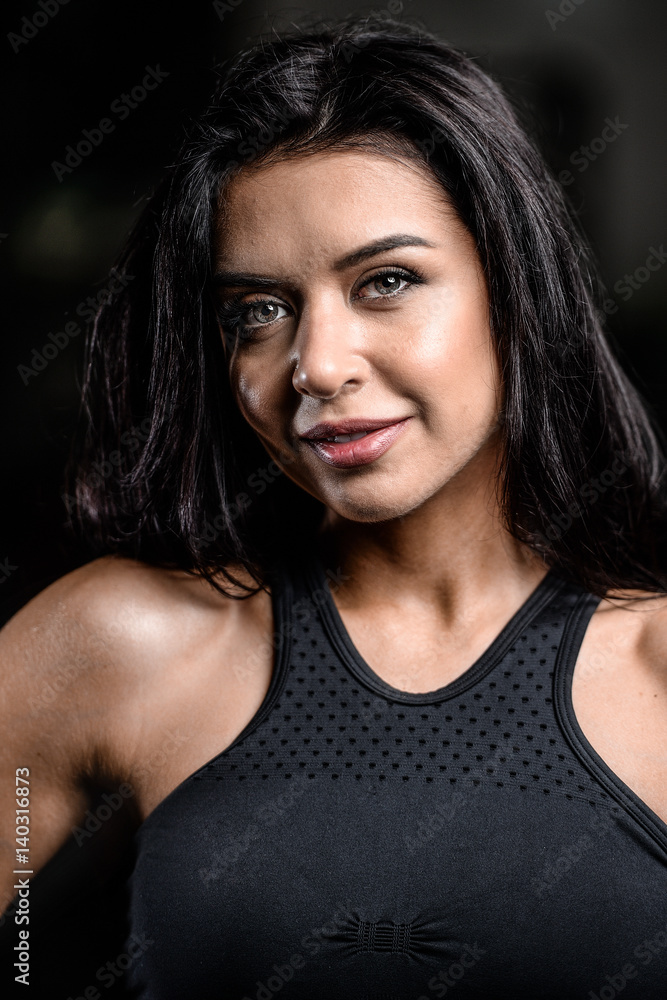 portrait of beautiful sexy girl on background of gym portrait of beautiful sexy girl on background of gym
