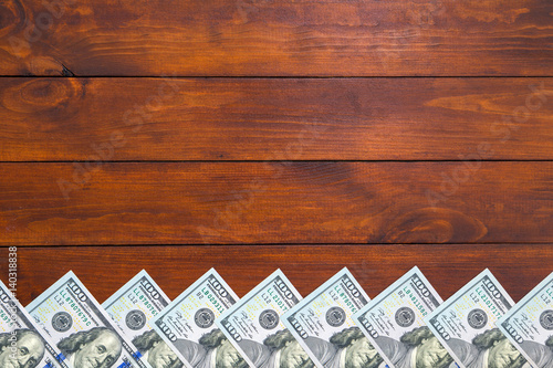 dollar bills frame with nice wooden background. Mock up for designers. photo