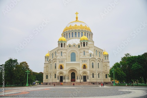 Russia, Kronstadt. Naval Cathedral of Saint Nicholas the Wonderworker with gold anchors on main dome. View from Anchor square.