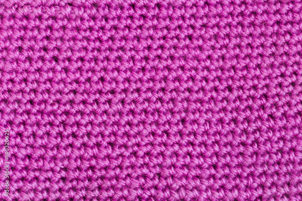 Texture of pink knitted fabric Texture of pink knitted fabric