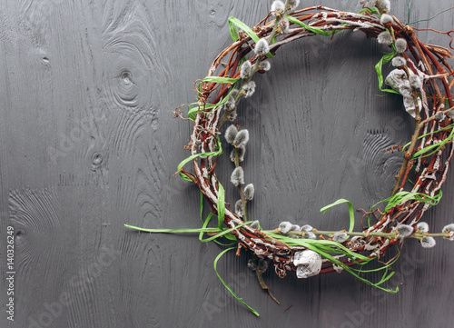 Easter concept wreath on a wooden background