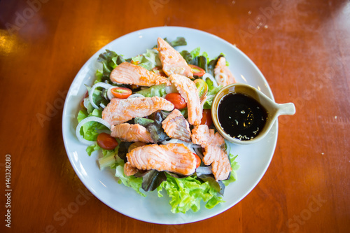 fried salmon salad with shoyu sauce.