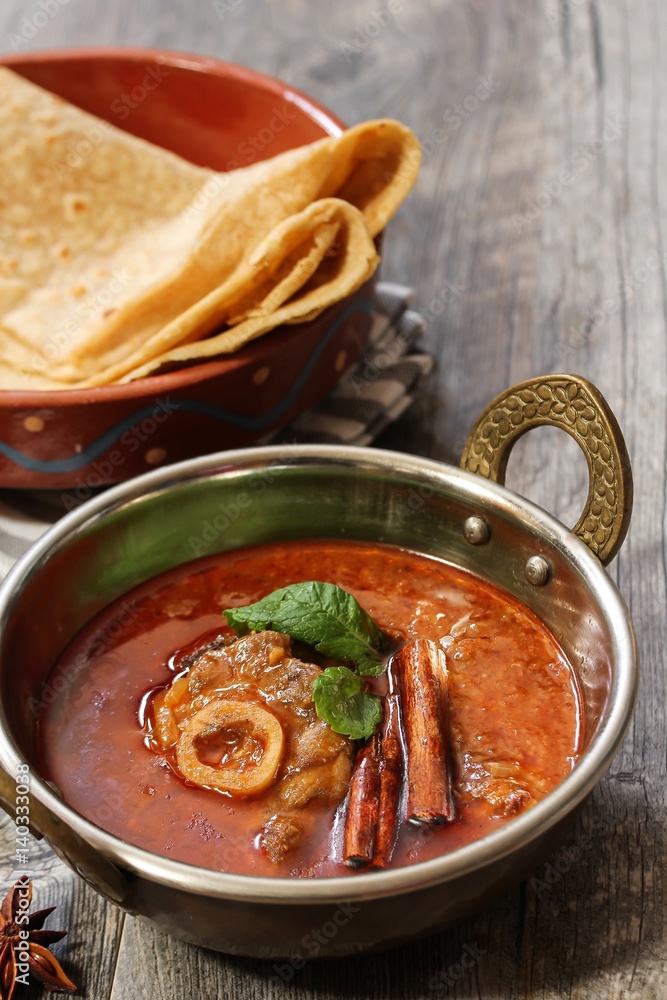 Rogan Josh / Kashmiri Lamb curry served in a Kadai, selective focus Rogan Josh / Kashmiri Lamb curry served in a Kadai, selective focus