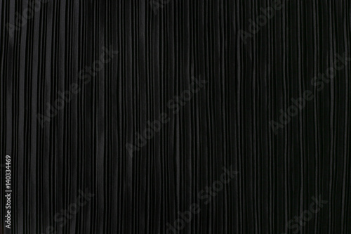 Black pleated fabric. Plisse fabric background texture. photo