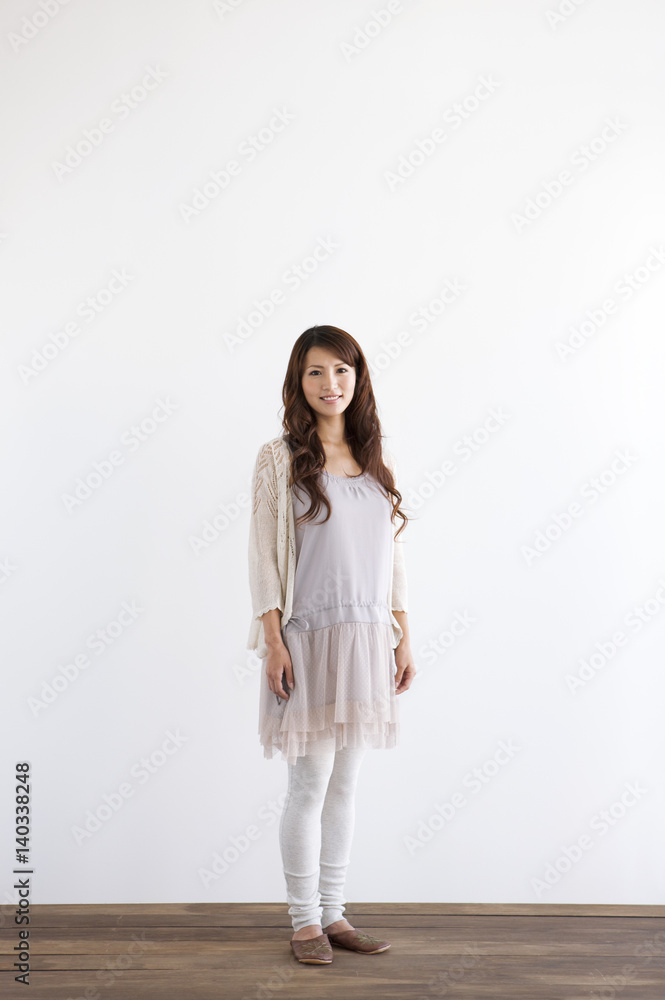 Portrait of young woman, smiling, white background, copy space Portrait of young woman, smiling, white background, copy space
