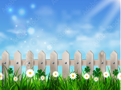 Green grass lawn with sunrise on blue sky