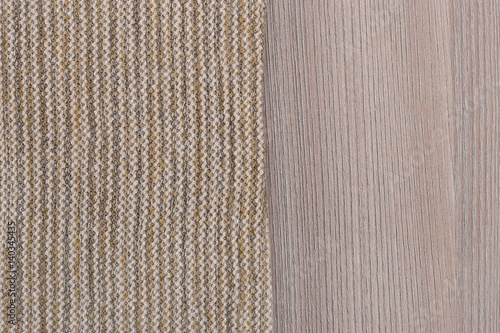 Fabric from left side wooden table top view. Soft brown background with empty place for design. Brown yellow woven texture / wood texture.