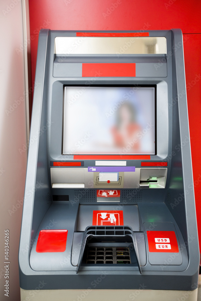 Photography of red cash dispenser Photography of red cash dispenser