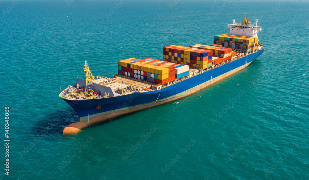 container ship in import export and business logistic.By crane ,Trade Port , Shipping.cargo to harbor.Aerial view.Top view. container ship in import export and business logistic.By crane ,Trade Port , Shipping.cargo to harbor.Aerial view.Top view.