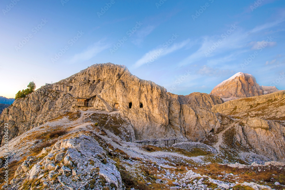 Ancient Cave houses in the mountains on the Passo Falzarego in the Dolomites in South Tyrol, Alps, Italy at sunrise.