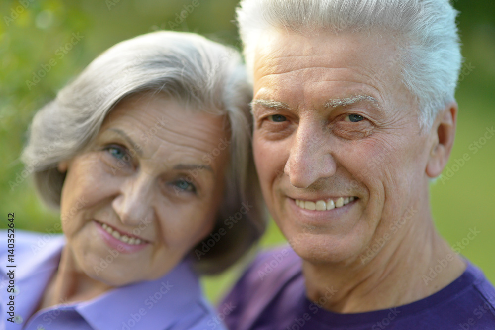 Happy elderly couple embracing