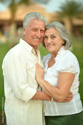 Happy elderly couple embracing