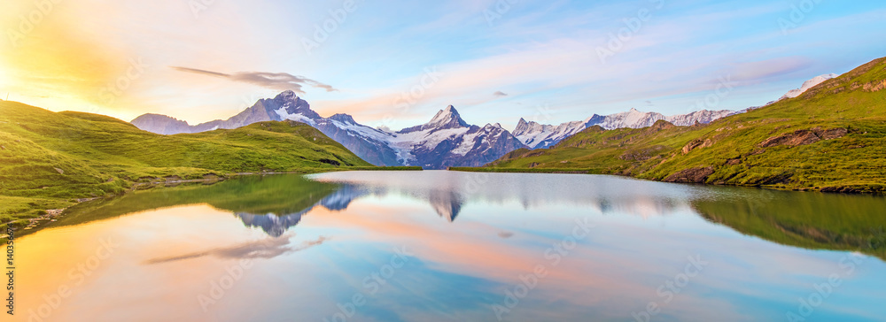 Fantastic landscape at sunrise over the lake in the Swiss Alps, Europe. Wetterhorn, Schreckhorn, Finsteraarhorn et Bachsee. ( relaxation, harmony, anti-stress - concept).