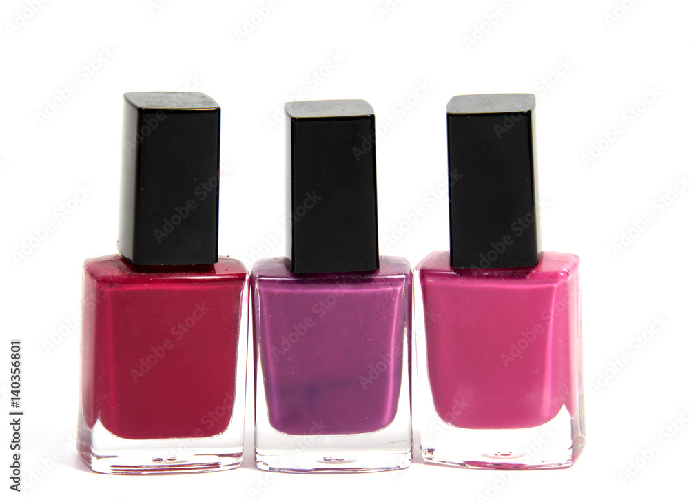 Bottles With Spilled Nail Polish Over White Background Bottles With Spilled Nail Polish Over White Background
