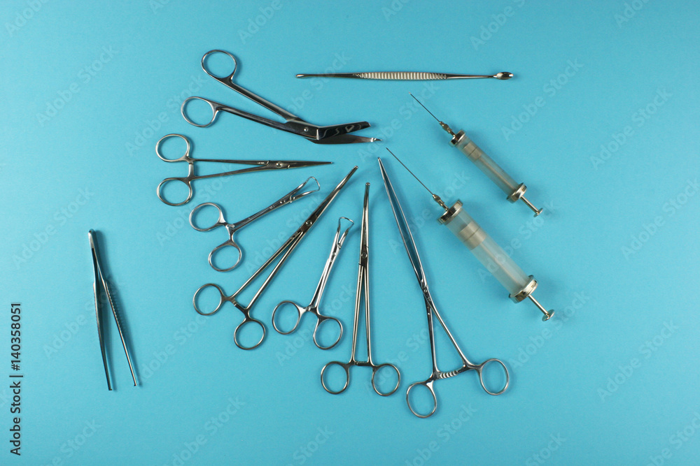 Surgical Instruments on blue background. Surgical Instruments on blue background.