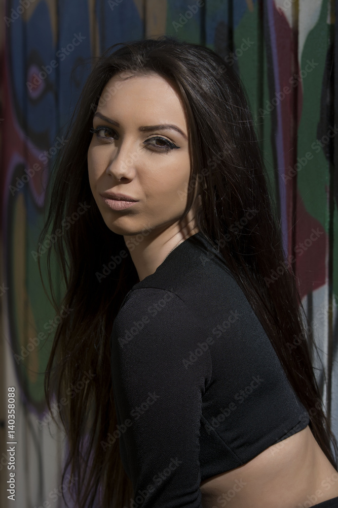 Young woman with black overalls posing outdoor Young woman with black overalls posing outdoor