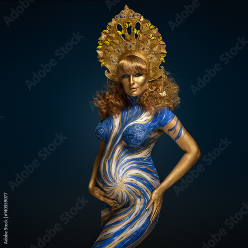 Принти на полотні Fashionable redhead pregnant woman with kokoshnik and abstract body art in shade