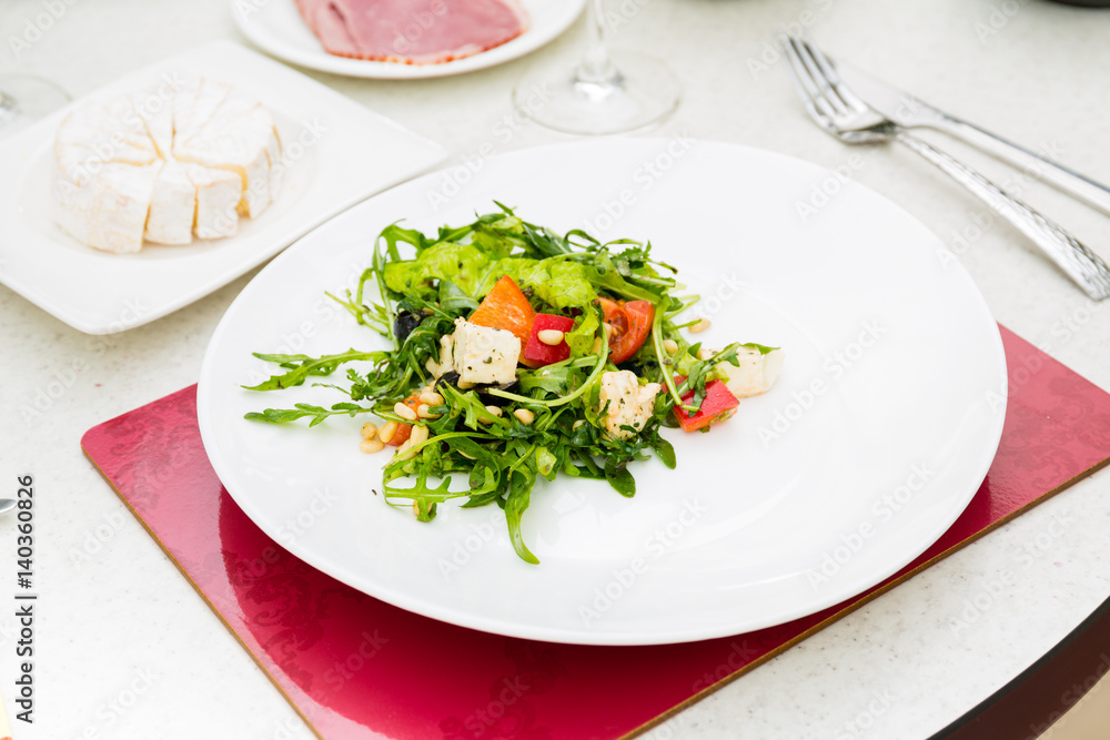 The salad with rucola and pine nuts The salad with rucola and pine nuts