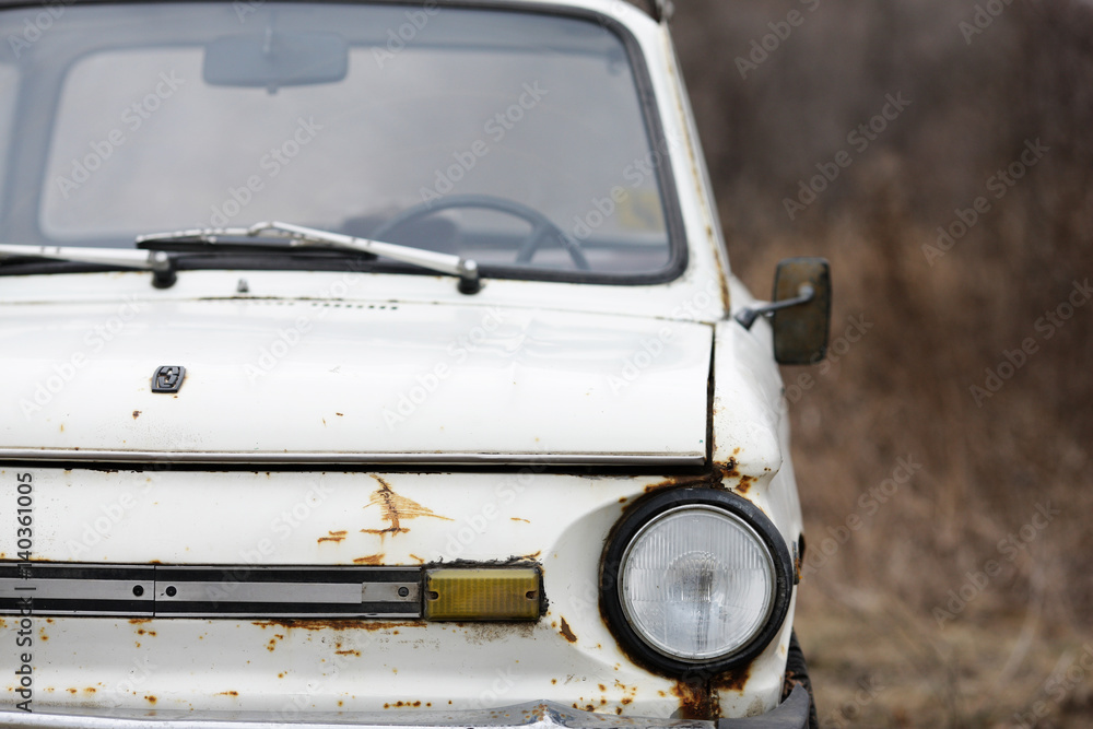 Fototapeta premium Old car white on a nature background