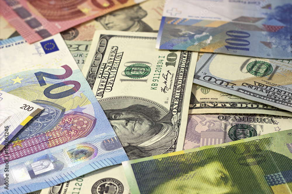 Obraz premium Money background american dollars, euro and swiss franc.
