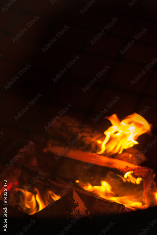 Fire flames on black background - barbecu fire place Fire flames on black background - barbecu fire place