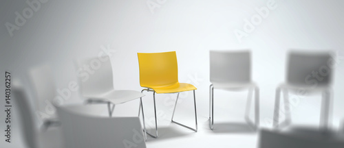 Single yellow chair in a group of white ones