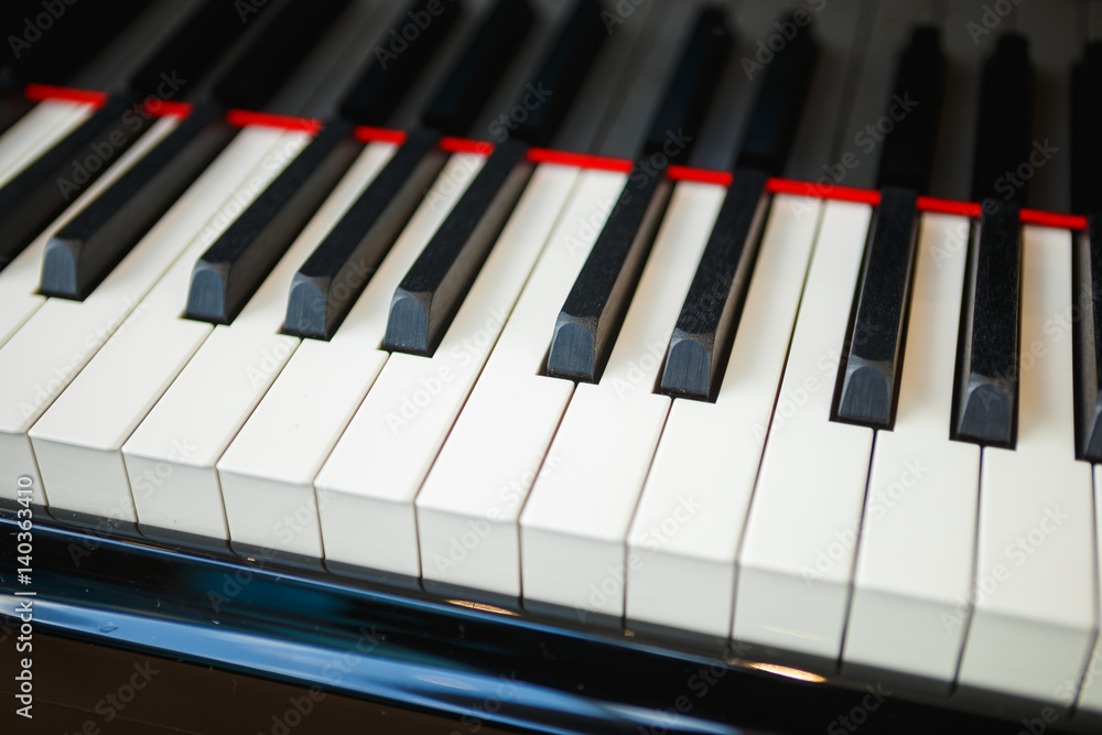 Black and white keys of a brilliant new piano. Close-up Black and white keys of a brilliant new piano. Close-up