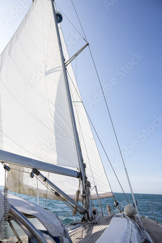 Yacht Sailing On Sea Against Blue Sky © Tyler Olson