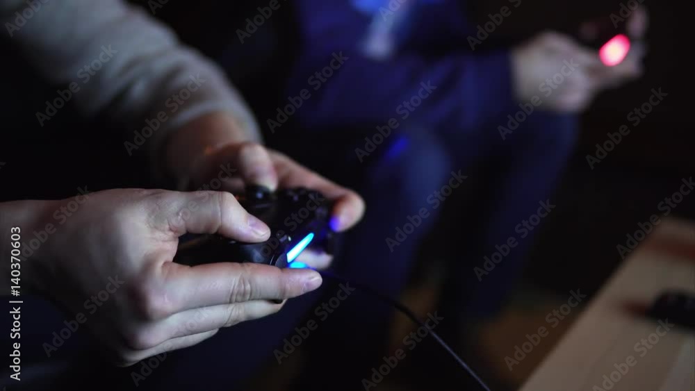 Close up shot of two guys playing video game console squabble. Close up shot of two guys playing video game console squabble.