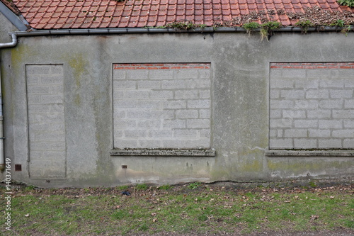 Foto maison aux ouvertures murées