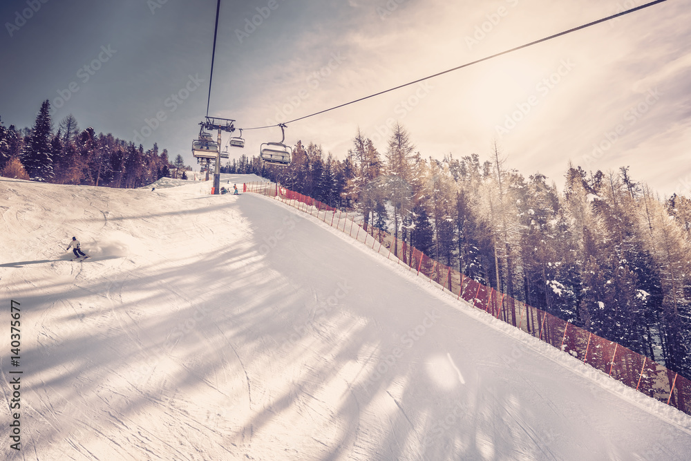 Sunny day on steep ski slope, winter landscape. Vintage filter Sunny day on steep ski slope, winter landscape. Vintage filter