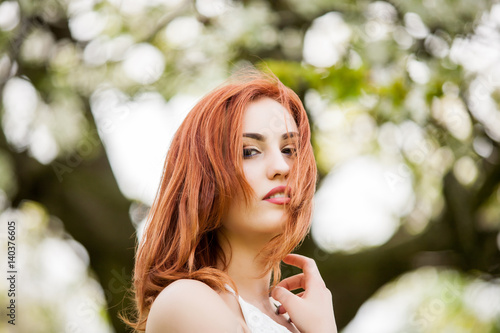 Sensual redhead woman outdoor photo