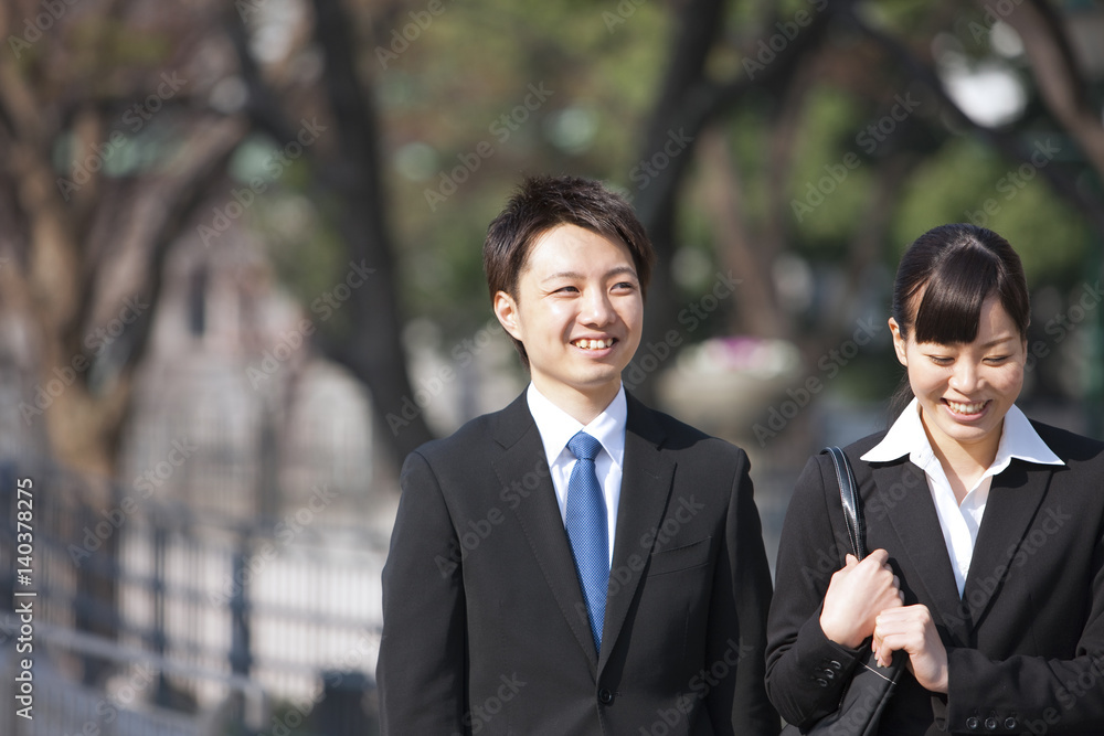 Young Businessman and Businesswoman Smiling Young Businessman and Businesswoman Smiling