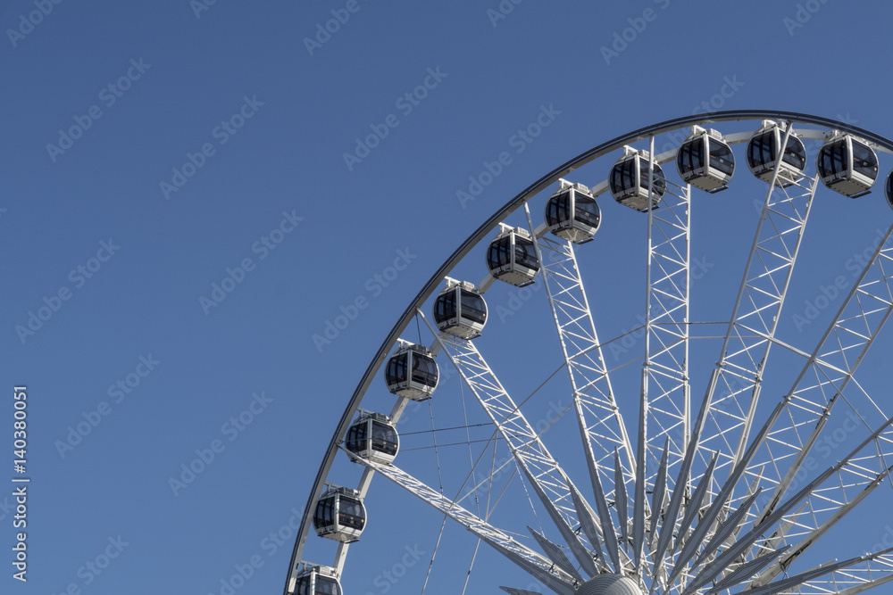 Ferris wheel before blue sky, partial view
Ferris wheel before blue sky, partial view