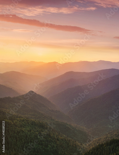 Hills lines in mountain valley during sunset. Natural summer mountain landscape..