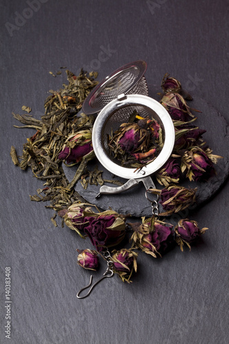 Green tea with roses blossoms